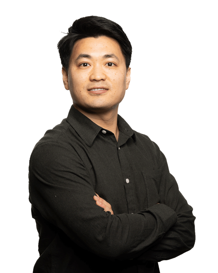 Gujon Wang_lowres_3_no-bg.png a person posing for the camera