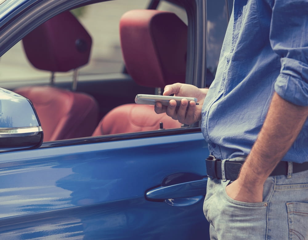 person car man holding sitting front woman hand using dog blue phone standing water table young seat playing riding bus hot bat ball boat video player game