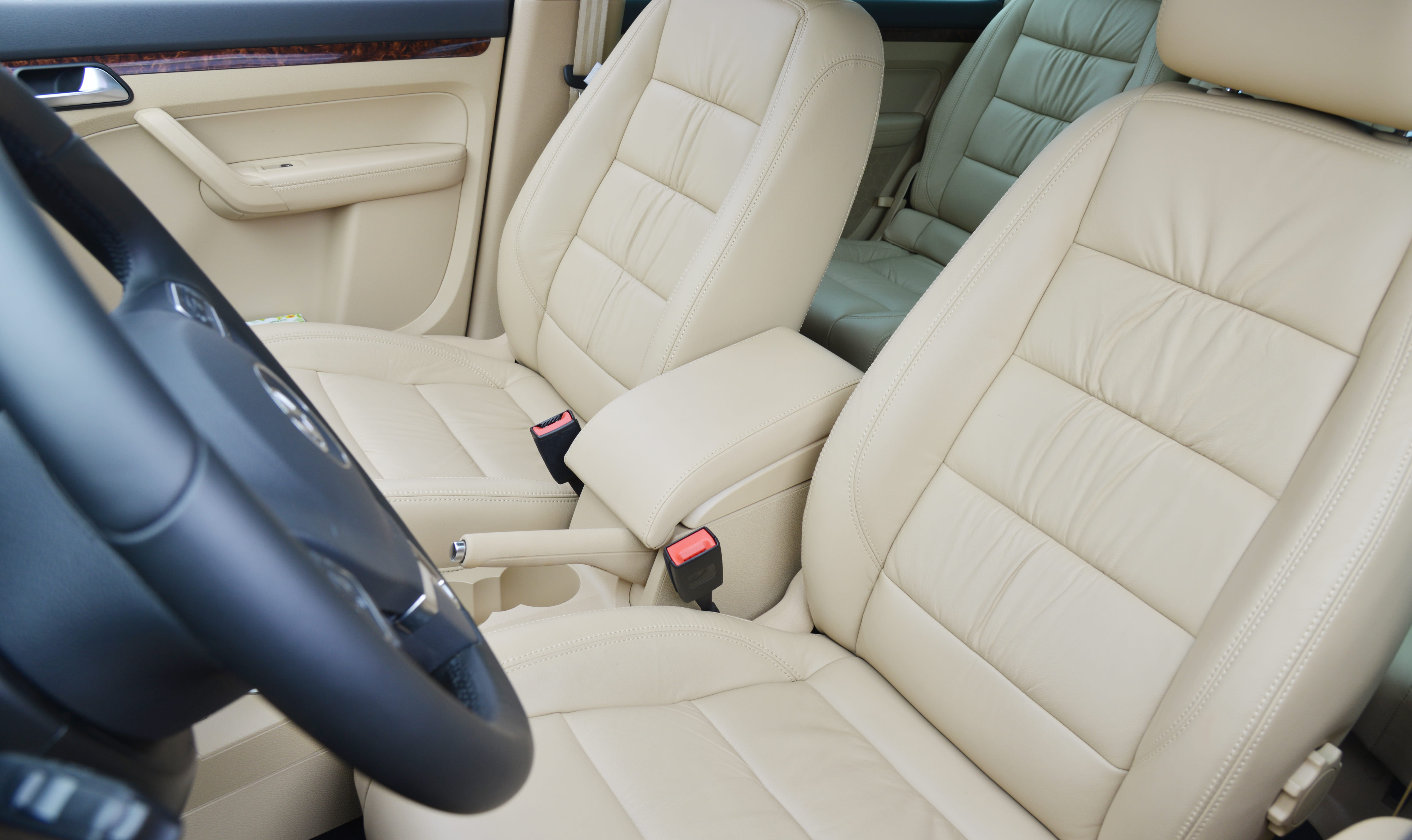 a person sitting on the seat of a car