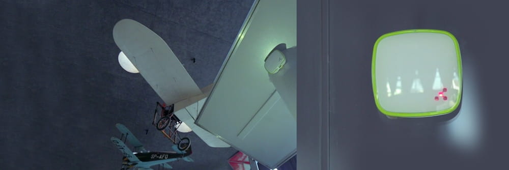 sitting small bus green table woman room standing computer man train blue