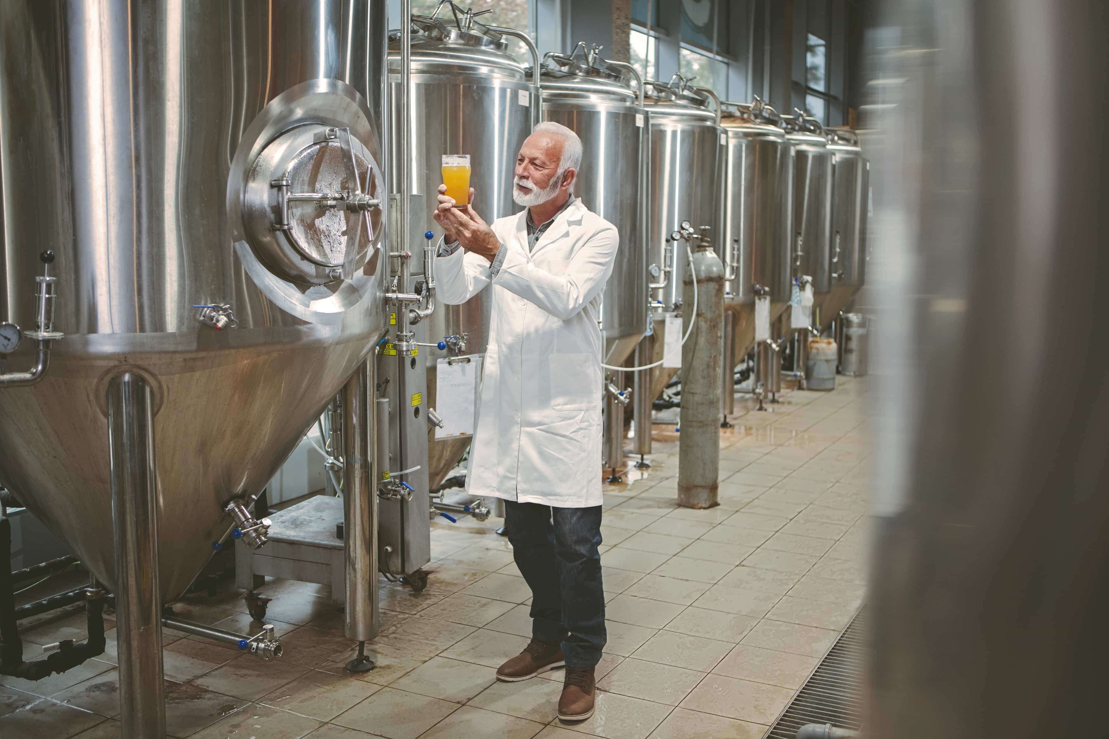 Man looking at a pint