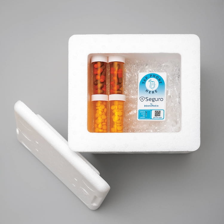 NS_SENSIFIED-1_WEB.jpg indoor sitting refrigerator table laying remote holding