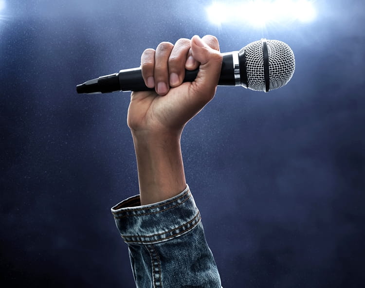 Virscient.jpg a person holding a microphone