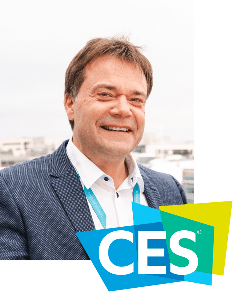 VW-CES.png Vegard Wollan wearing a suit and tie smiling at the camera