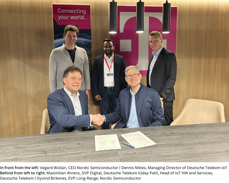 In front from the left Vegard Wollan, CEO Nordic Semiconductor  Dennis Nikles, Managing Director of Deutsche Telekom IoT Behind from left to right Maximilian Ahrens, SVP Digital, Deutsche Telekom-with-caption.png Vegard Wollan et al. sitting and standing in front of a building