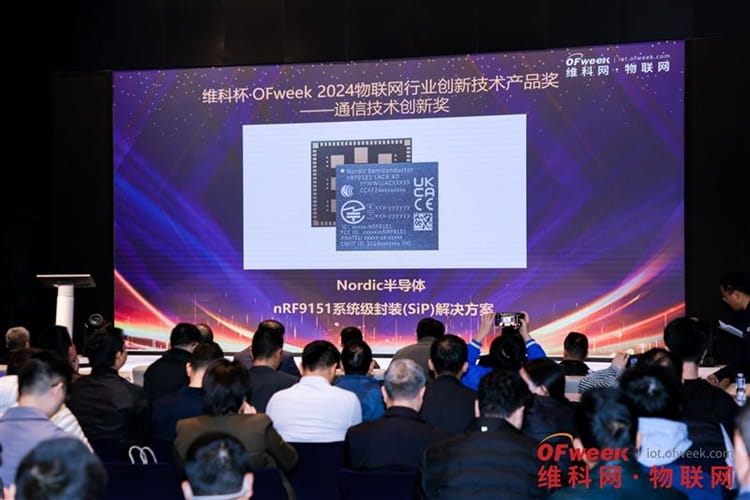 ofweekaward2024 4.jpg a group of people posing for a photo in front of a computer screen