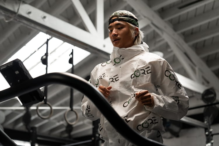 NS_CORE-2.jpg a man standing in front of a mirror posing for the camera