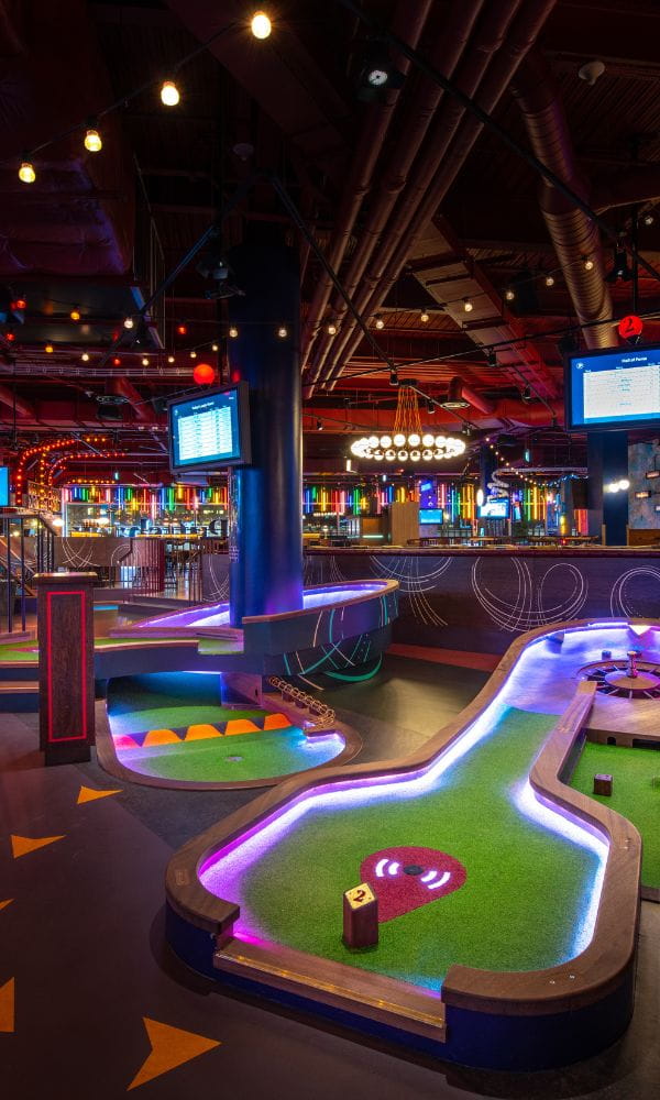 puttshack-inline.jpg a building lit up at night