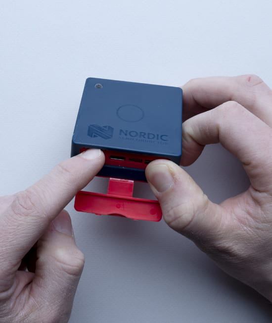 NordicThingy53_getting started_2.2.jpg Hand model powering on the Thingy:53