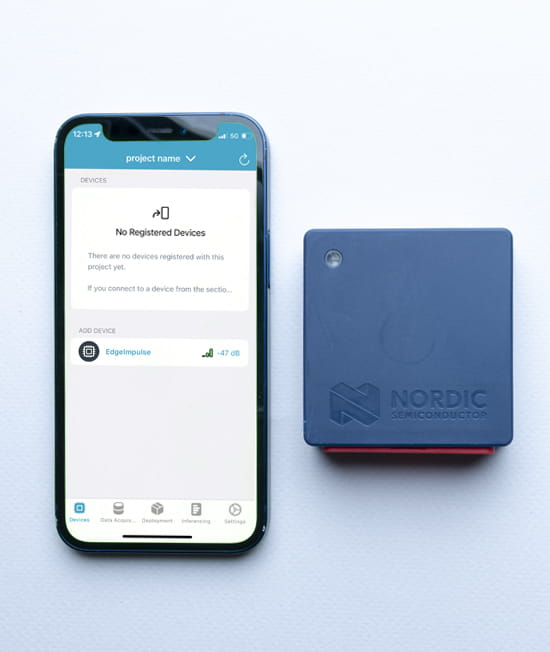 NordicThingy53_getting started_3.2.jpg iPhone with connecting screen for new Thingy:53 next to Thingy:53